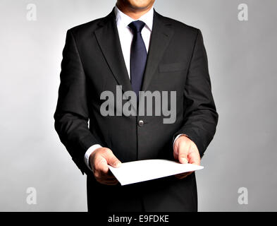 Businessman holds a booklet Stock Photo