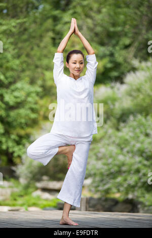 Woman exercising pilates. Double leg stretch exercise Stock Photo