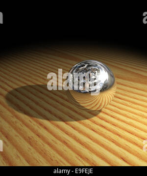 Metal sphere on wooden floor Stock Photo