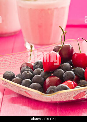 Blueberries and cherries in a bowl Stock Photo