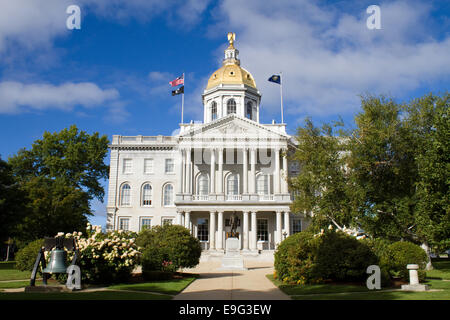 The state house capital building of New Hampshire is located in the city of Concord, NH, USA with surrounding grounds. Stock Photo
