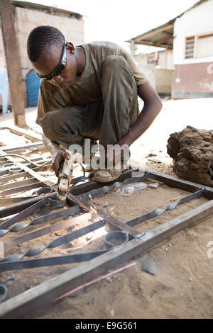 Welder at a workshop in Dar es Salaam, Tanzania, East Africa. Stock Photo