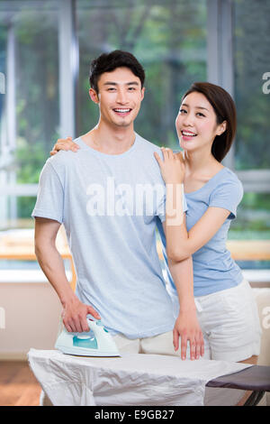 Young couple doing housework Stock Photo