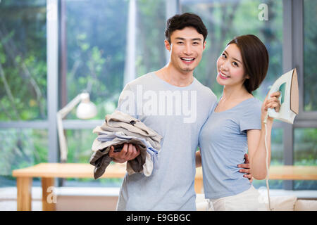 Young couple doing housework Stock Photo