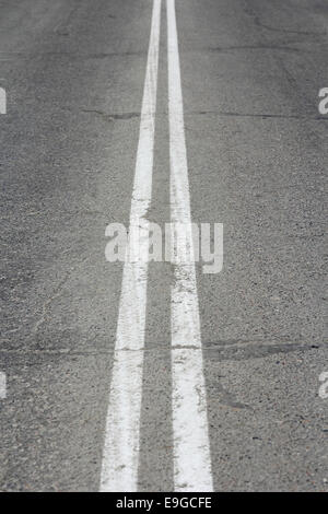 Asphalt highway with two white stripes Stock Photo