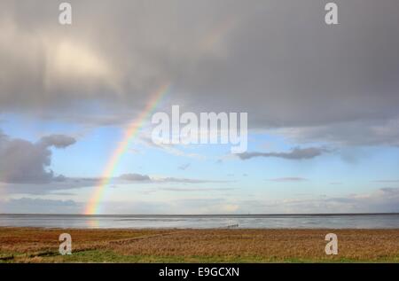 Rainbow over the wadden sea Stock Photo