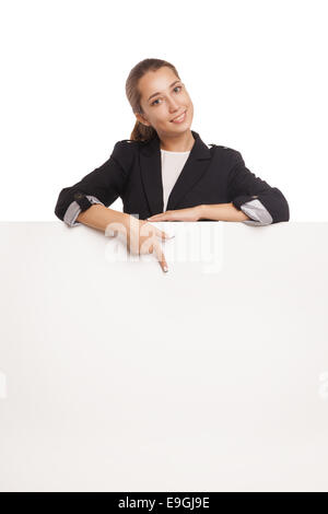 Portrait of a beautiful business woman holding blank billboard Isolated over white background Stock Photo