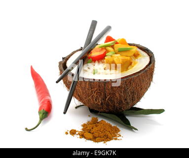 Coconut, rice and curry chicken on white background, close up Stock Photo