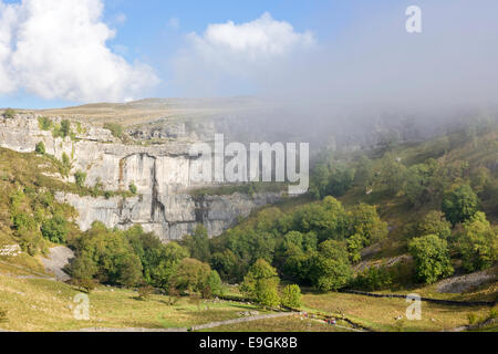 Early morning autumn mist over Malham Cove, Malham, Yorkshire Dales National Park, North Yorkshire, England, UK Stock Photo