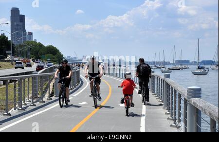 NYC:  Bicyclists enjoy a summer afternoon on the Hudson River bike path Stock Photo