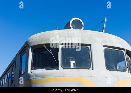 Closeup frontal view of an old diesel locomotive against the background of the clear blue sky Stock Photo