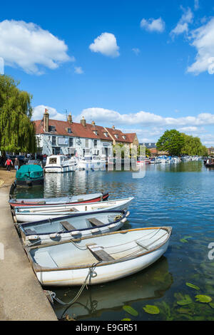 Rowing boats on the side of the river Camb in Ely. Stock Photo