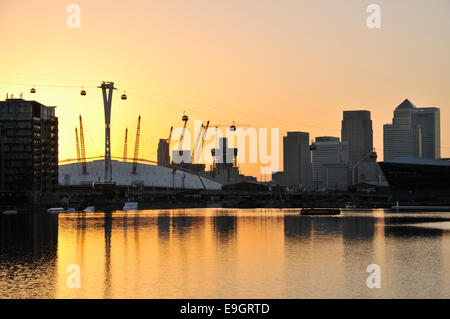 The London O2 Arena and Canary Wharf at dusk, from Royal Victoria Dock Stock Photo