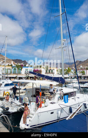 View over the marina and village towards mountains from Puerto de Mogan, Gran Canaria, Canary Islands, Spain Stock Photo