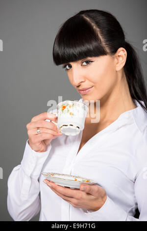 Woman holding a cup of tea, Germany Stock Photo