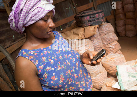 A small business owner on her mobile phone in Dar es Salaam, Tanzania. Stock Photo