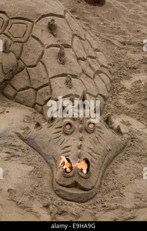 Fire-breathing dragon, sand sculpture, Torremolinos, Málaga province, Andalusia, Spain Stock Photo