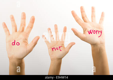 three hands with the words do not worry Stock Photo