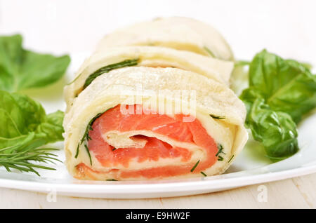 Salmon lavash rolls with cheese and herbs, close up view Stock Photo