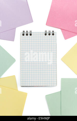 checked notebook  and note paper  on white background Stock Photo