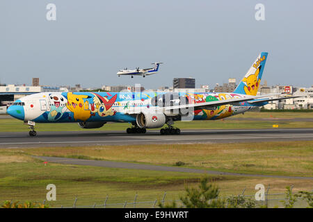 Osaka, Japan - May 25, 2014: An ANA All Nippon Airways Boeing 777 with the registration JA754A and Pokemon livery taxis at Osaka Stock Photo