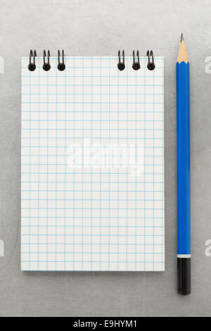 checked notebook at metal background texture Stock Photo
