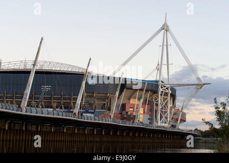 The Principality Stadium, formerly the Millennium Stadium at sunset sunrise on the River Taff in Cardiff, south Wales. Stock Photo