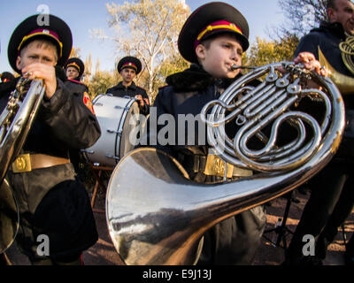 Kiev, Ukraine. 28th October, 2014. Brass Band of Cadets.  Kiev cadets and schoolchildren at Babi Yar, held a rally on the 70th anniversary of Ukraine's liberation. Babii Yar tragedy known worldwide. During the Second World War, the Nazis executed here 100 thousand inhabitants of Kiev, mainly Jews. Celebration of Ukraine's liberation from the Nazis passed under the Russian occupation of the Crimea and Eastern Ukraine. Credit:  Igor Golovnov/Alamy Live News Stock Photo