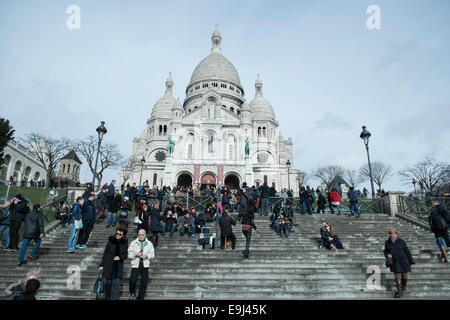 details and view of Paris from the Sacre coeur in Montmartre with tourists and crowds of people Stock Photo