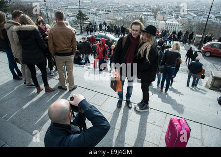 taking photos at Sacré-Cœur Basilica tourist landmark in paris france Stock Photo