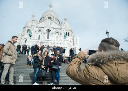 taking photos at Sacré-Cœur Basilica tourist landmark in paris france Stock Photo