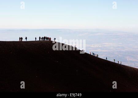 Clear sunny day on Mount Etna Sicily. Mount Etna is a stratovolcano near Catania , Siciliy Italy. It is an adventure travel day trip for many tourists Stock Photo