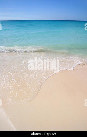 Beautiful white sand beach with turquoise sea & blue sky, Manchebo Beach, Aruba, Caribbean. Stock Photo