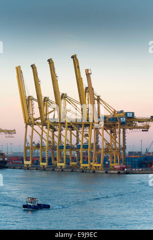 Cargo ships carrying containers of imports and exports at dock in Barcelona, Spain. Stock Photo