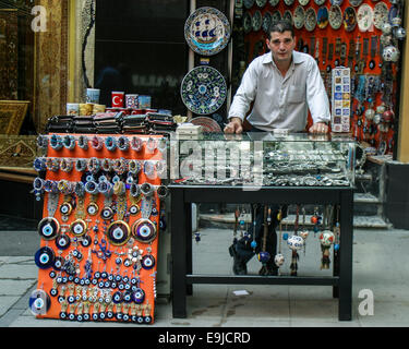 Istanbul, Turkey. 2nd Oct, 2004. A merchant stands behind his street stand displaying jewelry and souvenirs in Istanbul, Turkey. © Arnold Drapkin/ZUMA Wire/Alamy Live News Stock Photo