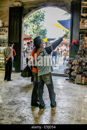 Istanbul, Turkey. 2nd Oct, 2004. Tourists pointing just inside the Beyazit Gate entrance to the Grand Bazaar of Istanbul, Turkey. © Arnold Drapkin/ZUMA Wire/Alamy Live News Stock Photo