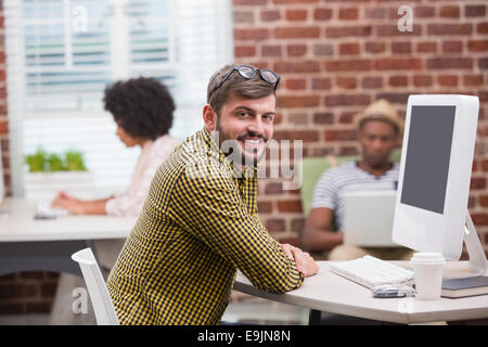 Portrait of casual young man using computer Stock Photo
