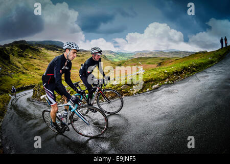 Two cyclists climbing Hardknott Pass in the English Lake District, 3rd place in Pro Photographers magazine (UK) award 2014 Stock Photo