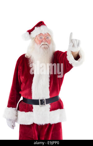 Portrait of Santa Claus pointing at something on color background Stock ...