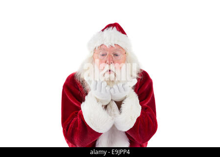 Santa Claus blows something away Stock Photo
