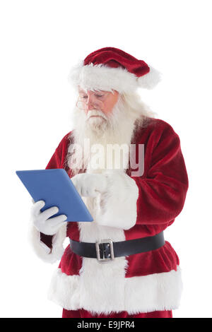 Santa uses a tablet PC Stock Photo