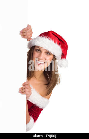 Festive girl smiling at camera holding poster Stock Photo