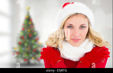 Composite image of happy festive blonde Stock Photo