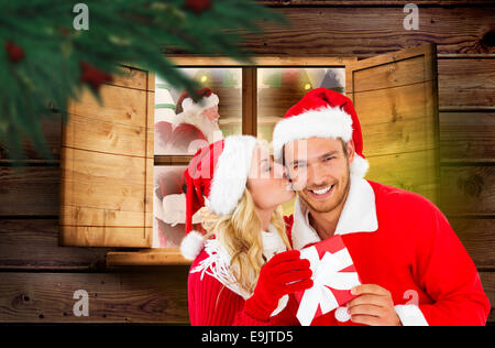 Composite image of young festive couple Stock Photo