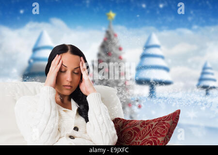 Composite image of woman suffering from a migraine Stock Photo