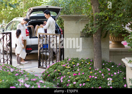 Young family coming back from shopping Stock Photo