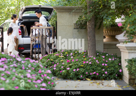 Young family coming back from shopping Stock Photo