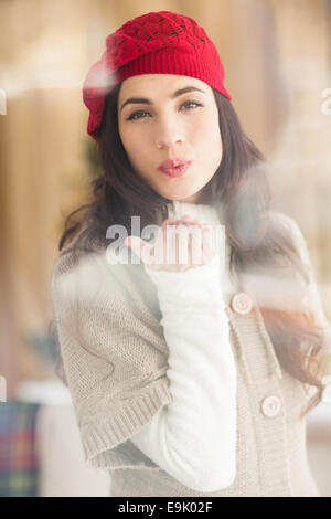 Pretty brunette blowing a kiss Stock Photo