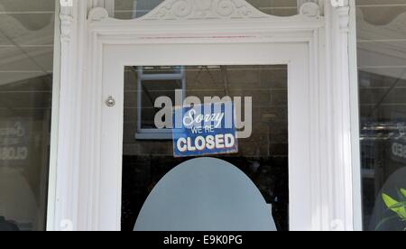 sorry we're closed sign on a shop door england uk Stock Photo