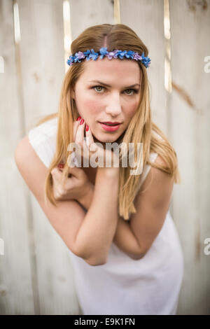 Pretty blonde woman posing while wearing headband Stock Photo